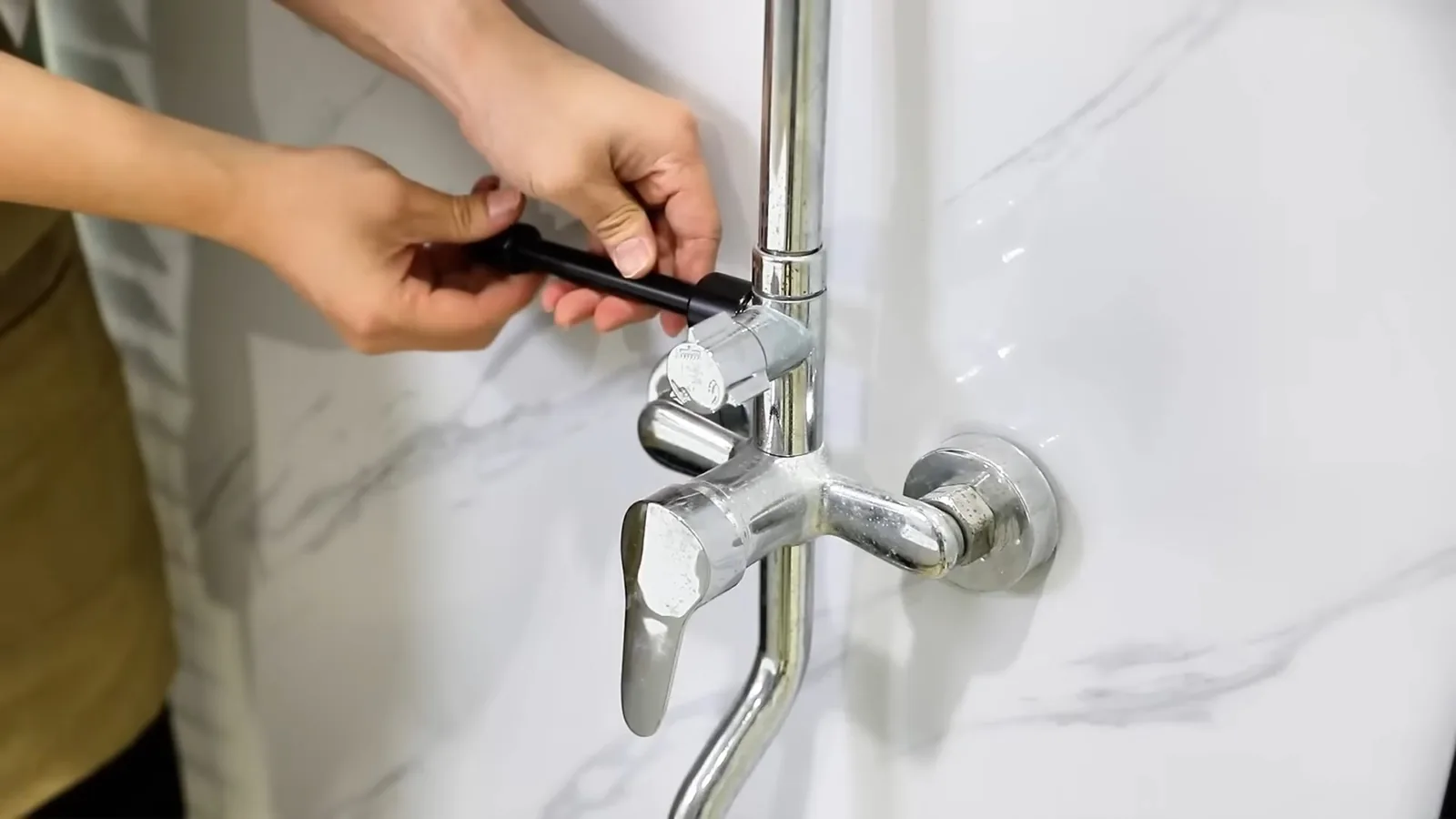 A tub spout and valve trim installed after tiling, representing Shower & Bathtub Installation service