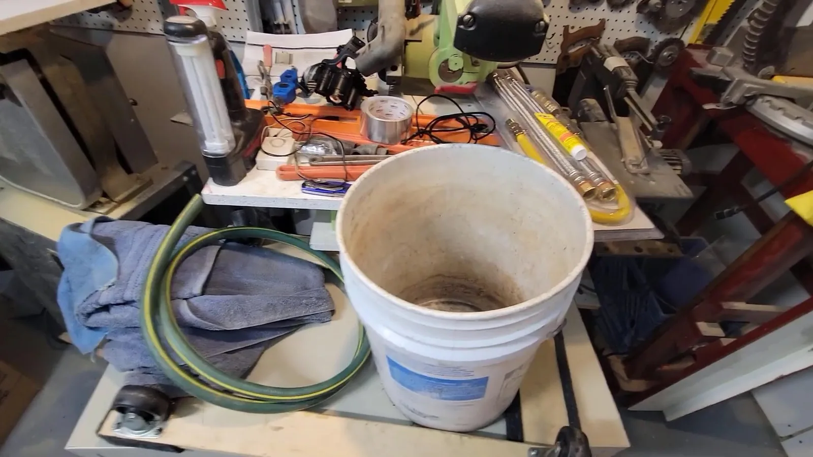 A drain snake being fed into a cleanout during Drain Cleaning & Unclogging service in Alpharetta
