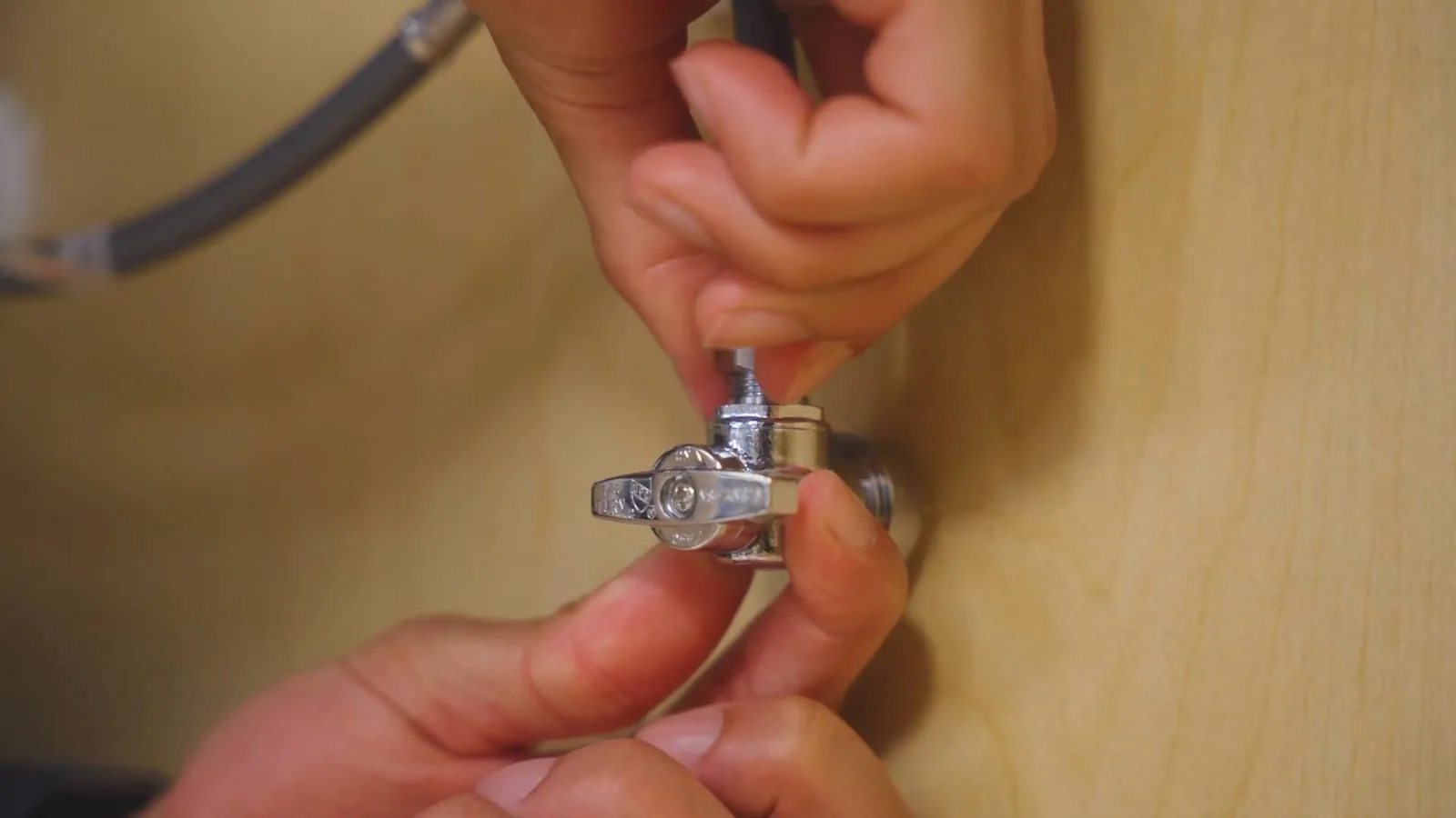 New faucet hardware installed at a kitchen sink, related to Faucet & Sink Repair questions homeowners ask