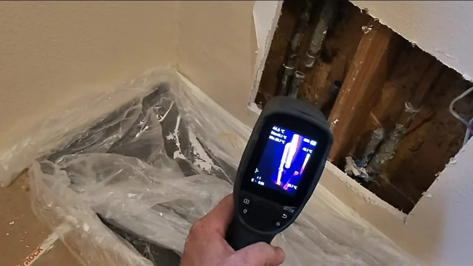 A technician using acoustic equipment to trace a hidden leak, related to Why Your Alpharetta Water Bill Spiked: And the Fulton County Leak Credit You Should Know About
