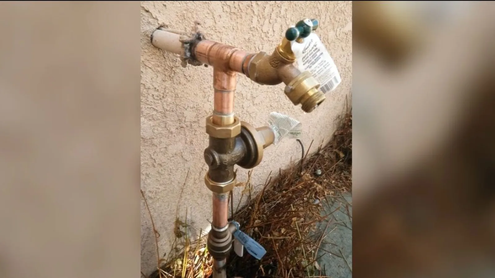 A frost-free hose bib being installed on an exterior wall during a service visit in Duluth, GA