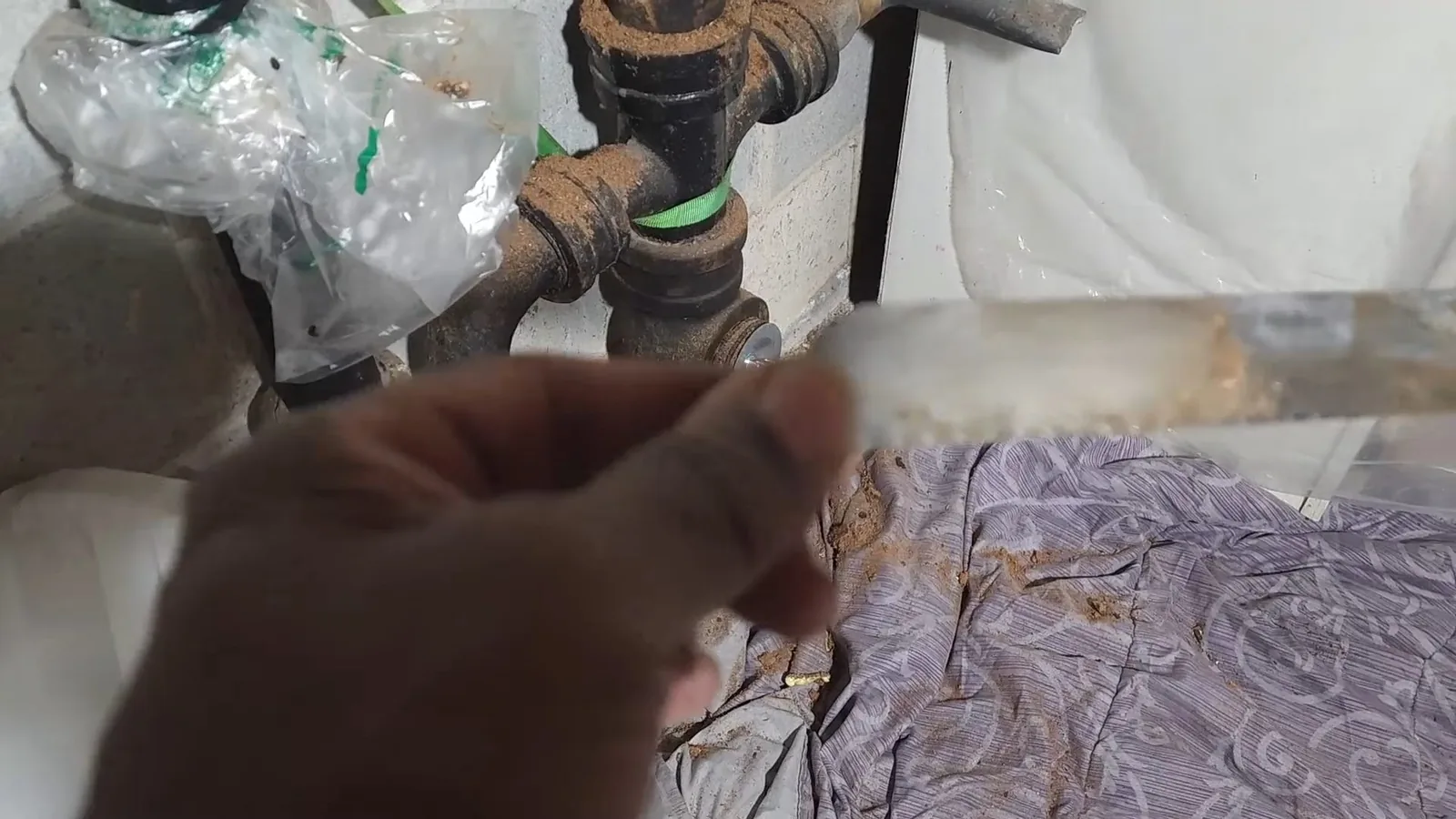A cleanout plug stuck in an aging cast iron fitting during a service visit in Norcross, GA