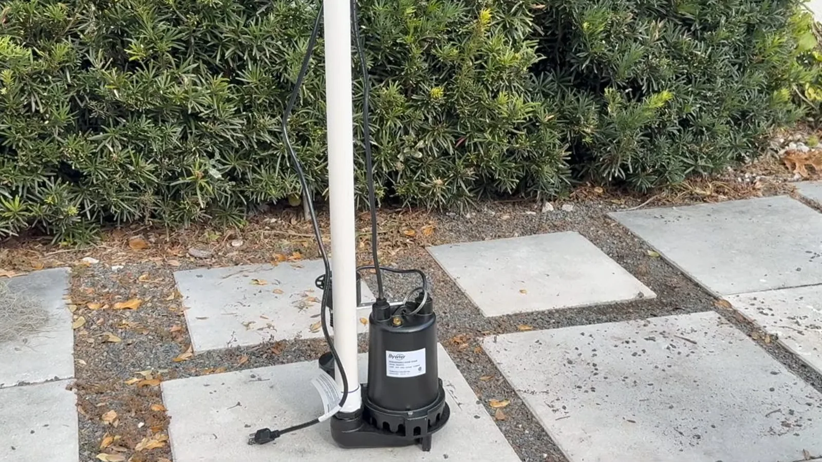 A failed sump pump removed for replacement, representing Sump Pump Installation & Repair service