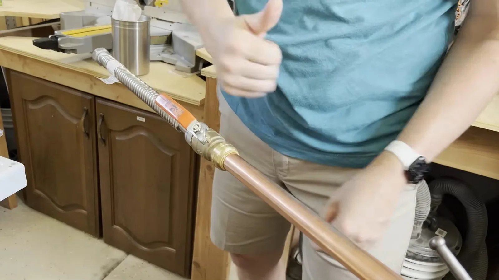 A water heater's cold and hot supply lines being connected on a plumbing call in Suwanee, GA