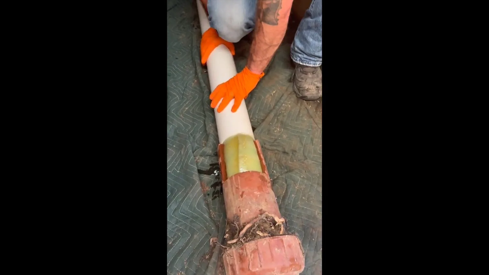 An old lead service line exposed during a water line replacement, representing plumbing service in Haynes Bridge