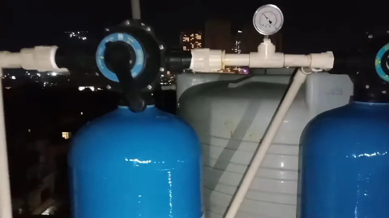 A water softener resin tank installed in a utility area during a service visit in Windward